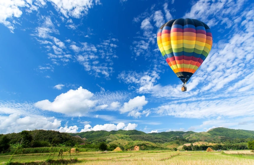 Air balloon floating in clear blue sky